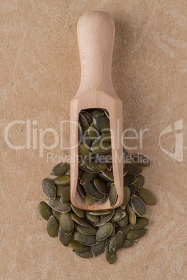 Wooden scoop with pumpkin seeds