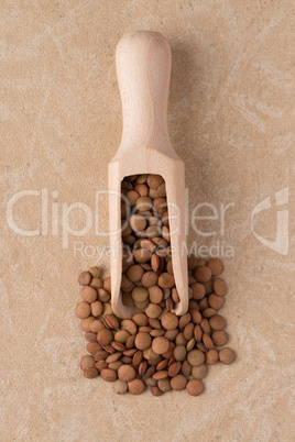 Wooden scoop with lentils