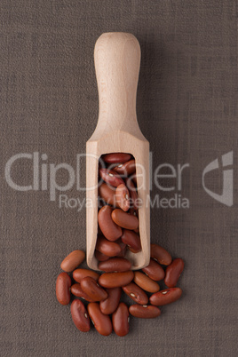 Wooden scoop with red beans