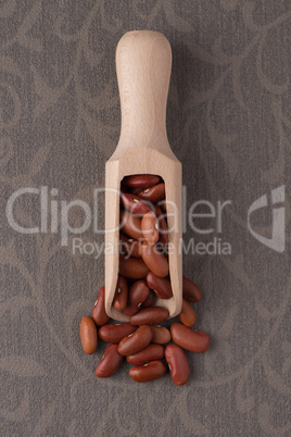 Wooden scoop with red beans