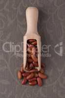 Wooden scoop with red beans