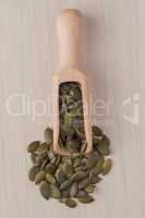 Wooden scoop with pumpkin seeds