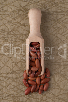 Wooden scoop with red beans