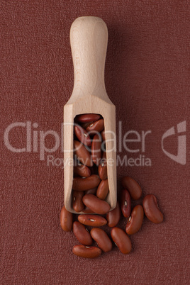 Wooden scoop with red beans