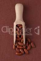 Wooden scoop with red beans