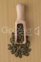 Wooden scoop with pumpkin seeds