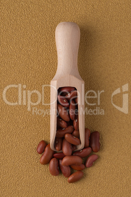 Wooden scoop with red beans