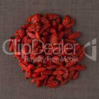 Circle of dry red goji berries