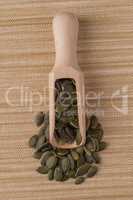 Wooden scoop with pumpkin seeds