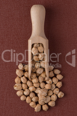 Wooden scoop with chickpeas