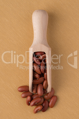 Wooden scoop with red beans