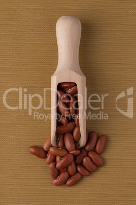 Wooden scoop with red beans