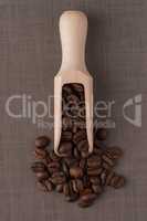 Wooden scoop with coffee beans