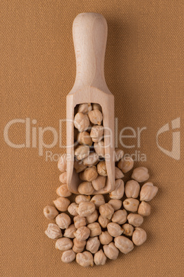 Wooden scoop with chickpeas