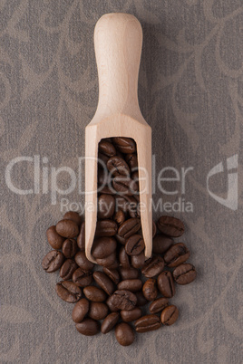 Wooden scoop with coffee beans