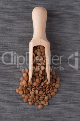 Wooden scoop with lentils