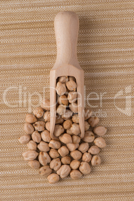 Wooden scoop with chickpeas