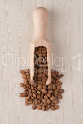 Wooden scoop with lentils