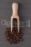 Wooden scoop with coffee beans