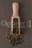 Wooden scoop with pumpkin seeds