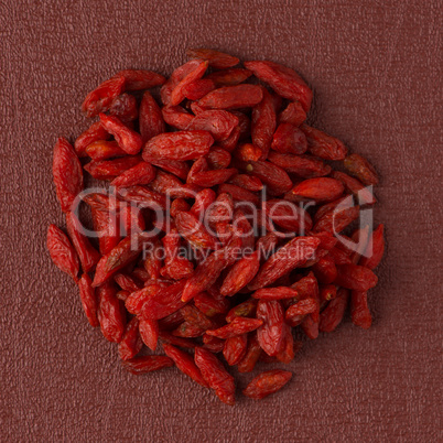 Circle of dry red goji berries