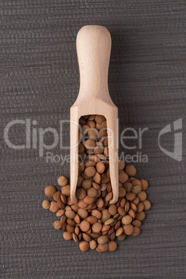 Wooden scoop with lentils