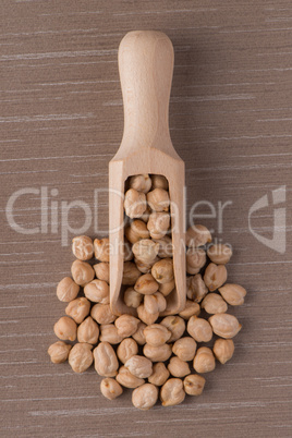 Wooden scoop with chickpeas