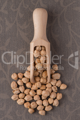 Wooden scoop with chickpeas