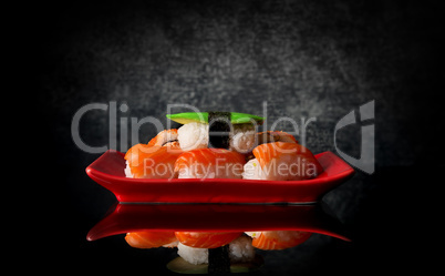 Sushi on red plate