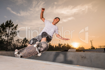 Skateboarder in a concrete pool