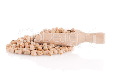 Uncooked chickpeas and wooden scoop