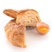 Croissant and raw egg