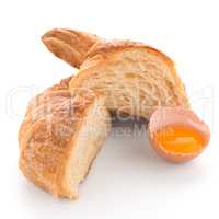 Croissant and raw egg