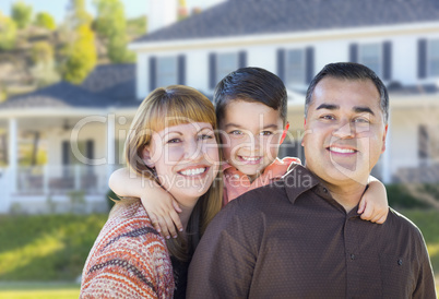 Happy Mixed Race Young Family in Front of House