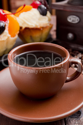 Clay coffee cup with cakes