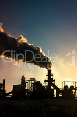 Smoking chimney  at sunset