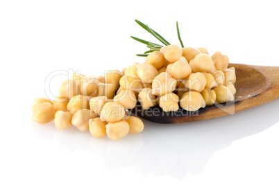 Chickpeas over wooden spoon