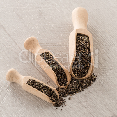 Chia seeds in wooden scoops
