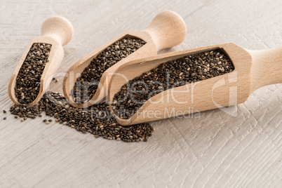 Chia seeds in wooden scoops