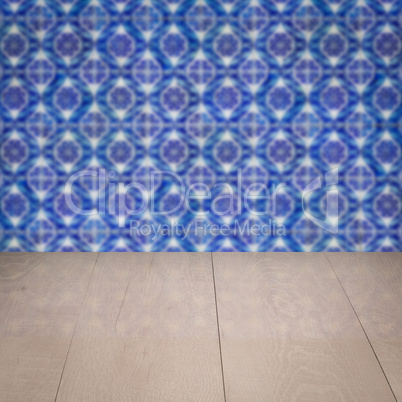 Wood table top and blur vintage ceramic tile pattern wall