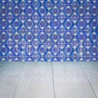 Wood table top and blur vintage ceramic tile pattern wall