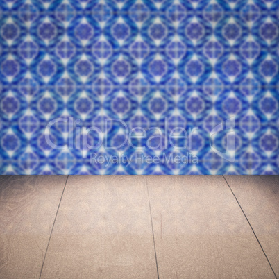 Wood table top and blur vintage ceramic tile pattern wall