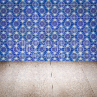 Wood table top and blur vintage ceramic tile pattern wall