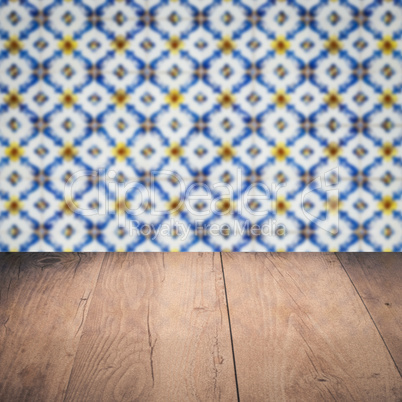 Wood table top and blur vintage ceramic tile pattern wall