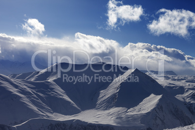 Snow mountains and sunlight clouds in evening