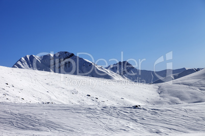 Off piste slope at nice sunny morning