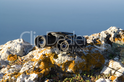 Binoculars on the rock