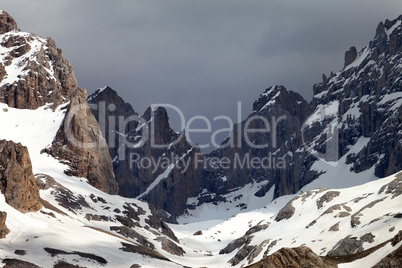 Snowy mountains and storm clouds