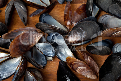 Shells of mussels on kitchen board