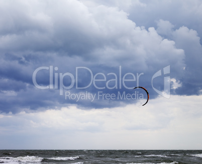 Power kite in sea and cloudy sky
